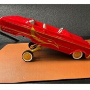 Red plastic low ride vehicle car